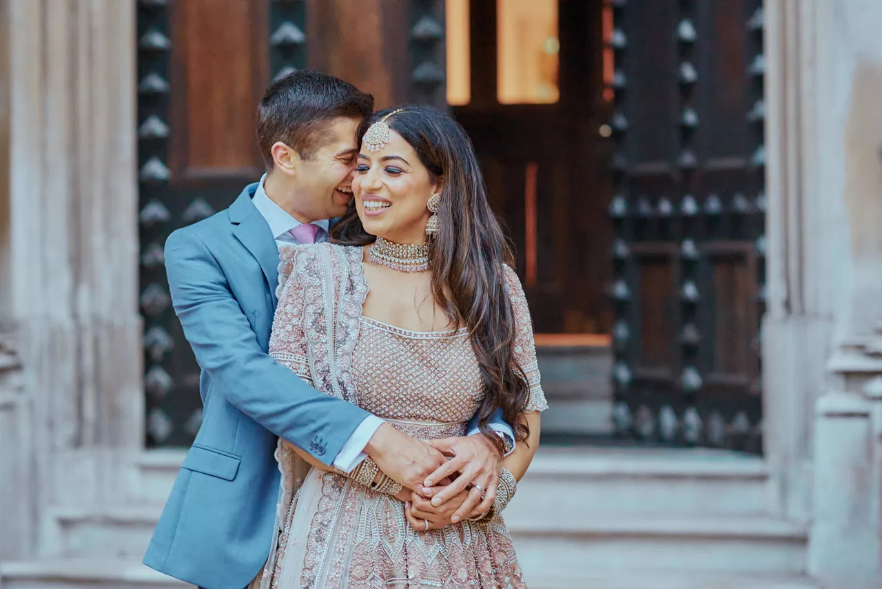 Bride & Groom in the grounds of Highcliffe Castle in Dorset during an  Indian Fusion Wedding.