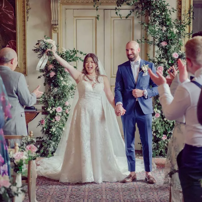 Bride & Groom having fun during their wedding ceremony at St Giles House in Dorset