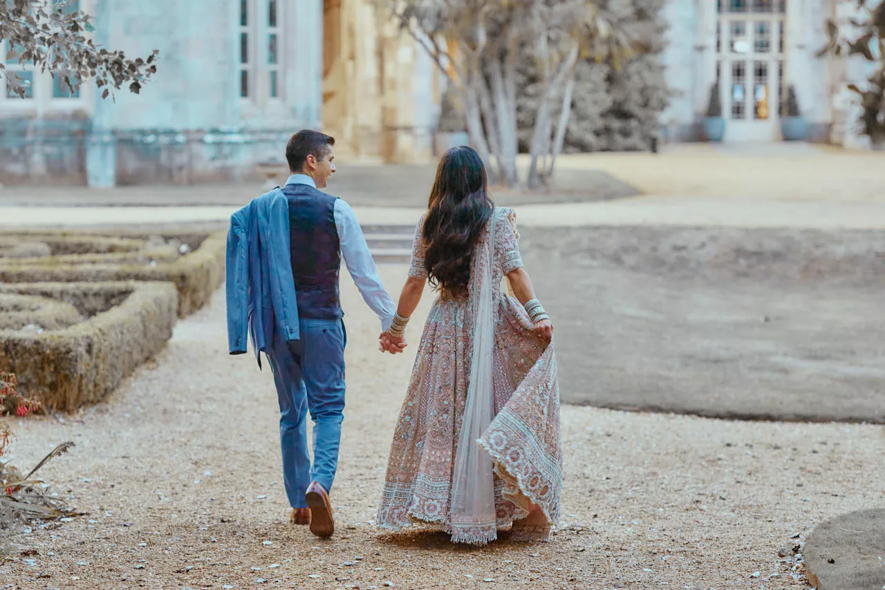 Bride & Groom in the grounds of Highcliffe Castle in Dorset during an  Indian Fusion Wedding.