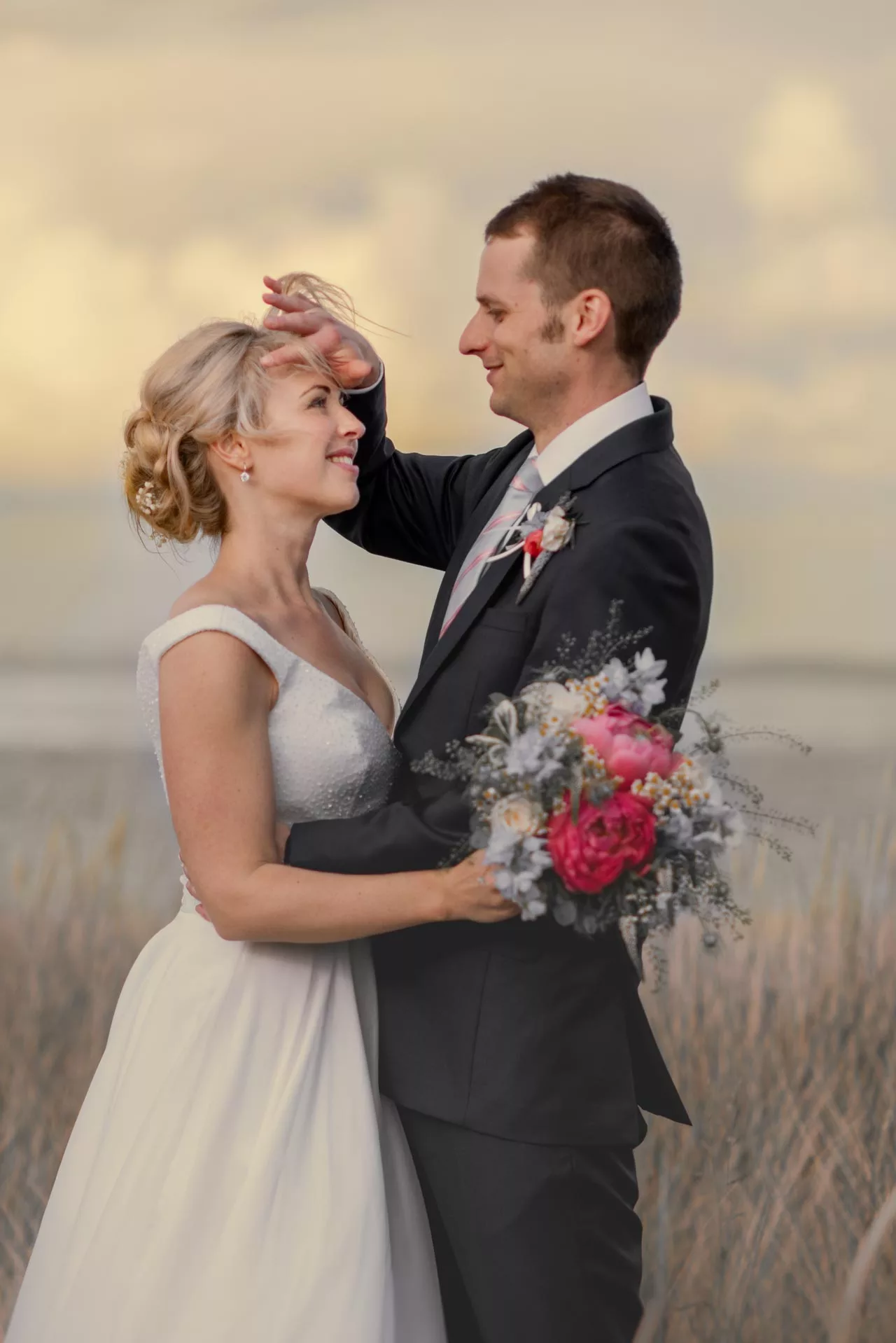 Natural & relaxed wedding photo of Bride & Groom on beach near Highcliffe castle in Dorset