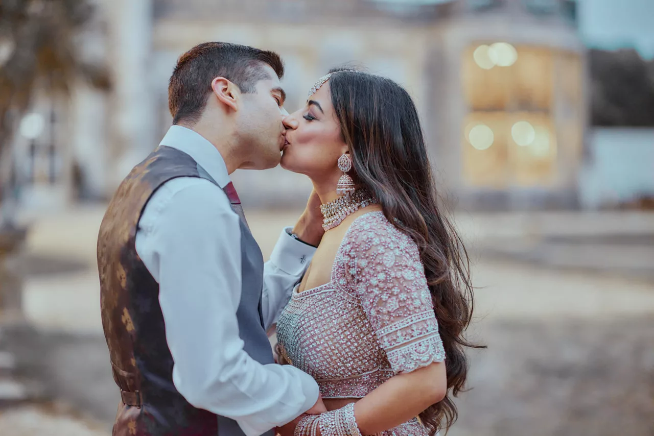 Bride & Groom in the grounds of Highcliffe Castle in Dorset during an  Indian Fusion Wedding.