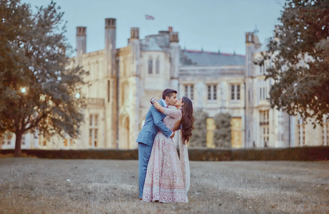 A Beautiful photo of Bride & Groom in the grounds of Highcliffe Castle in Dorset during an Indian Fusion Wedding.