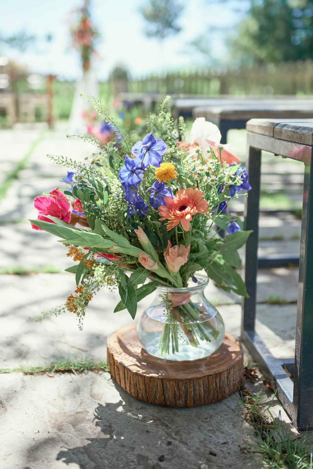 Examples of the beautiful flower armaments for the isle during outdoor wedding ceremony at Sopley Mill 