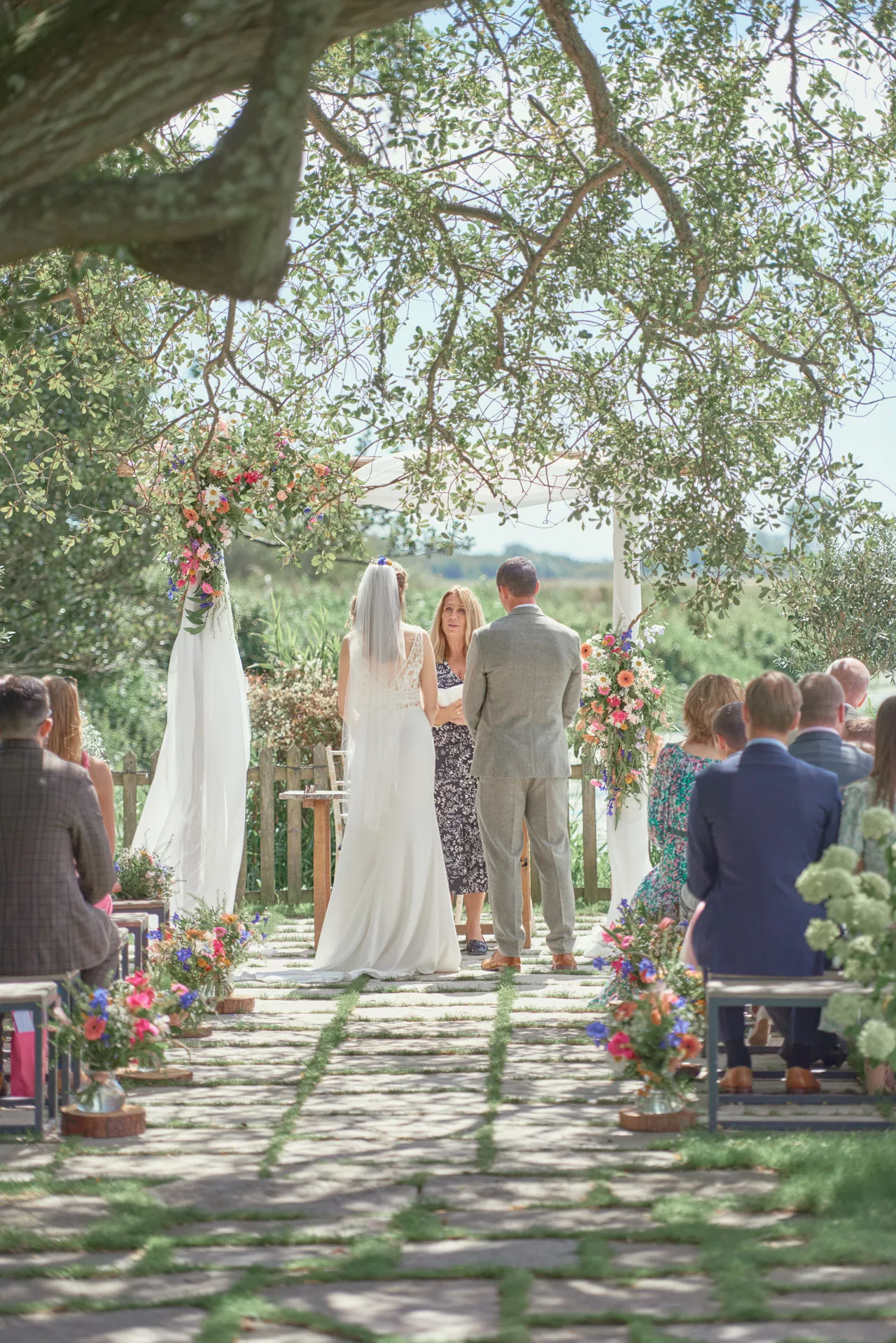 Bride and groom an outdoor wedding ceremony at Sopley Mill
