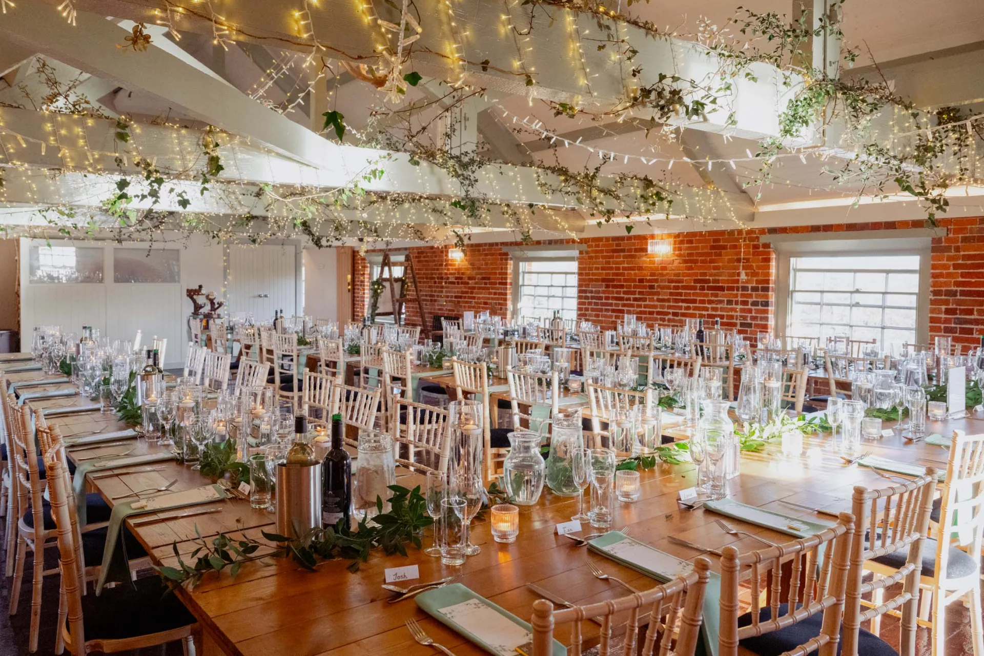 Trestle tables set out for wedding breakfast at Sopley Mill in 2026