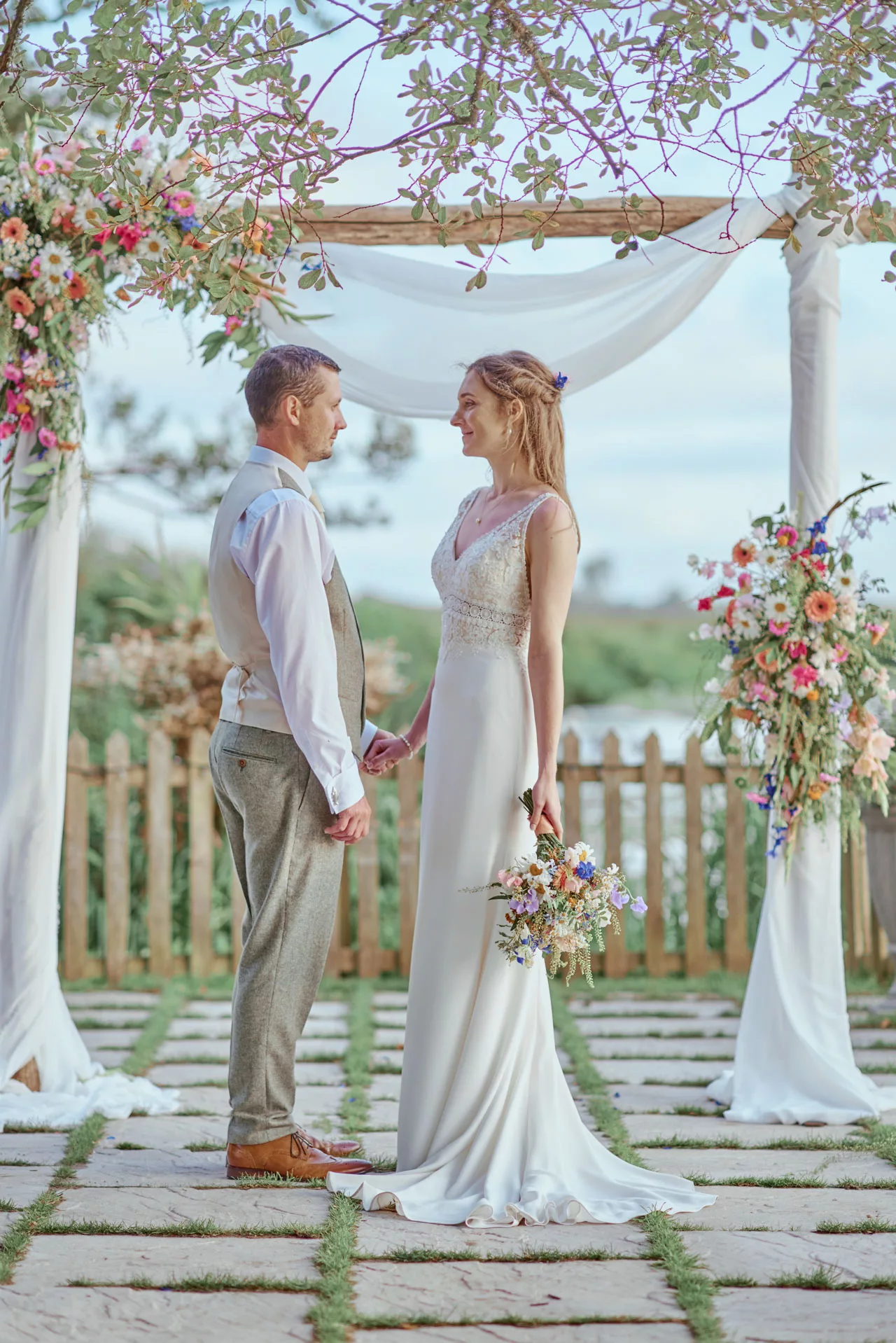 A Beautiful Portrait of Bride and Groom by the river at Sopley Mill 