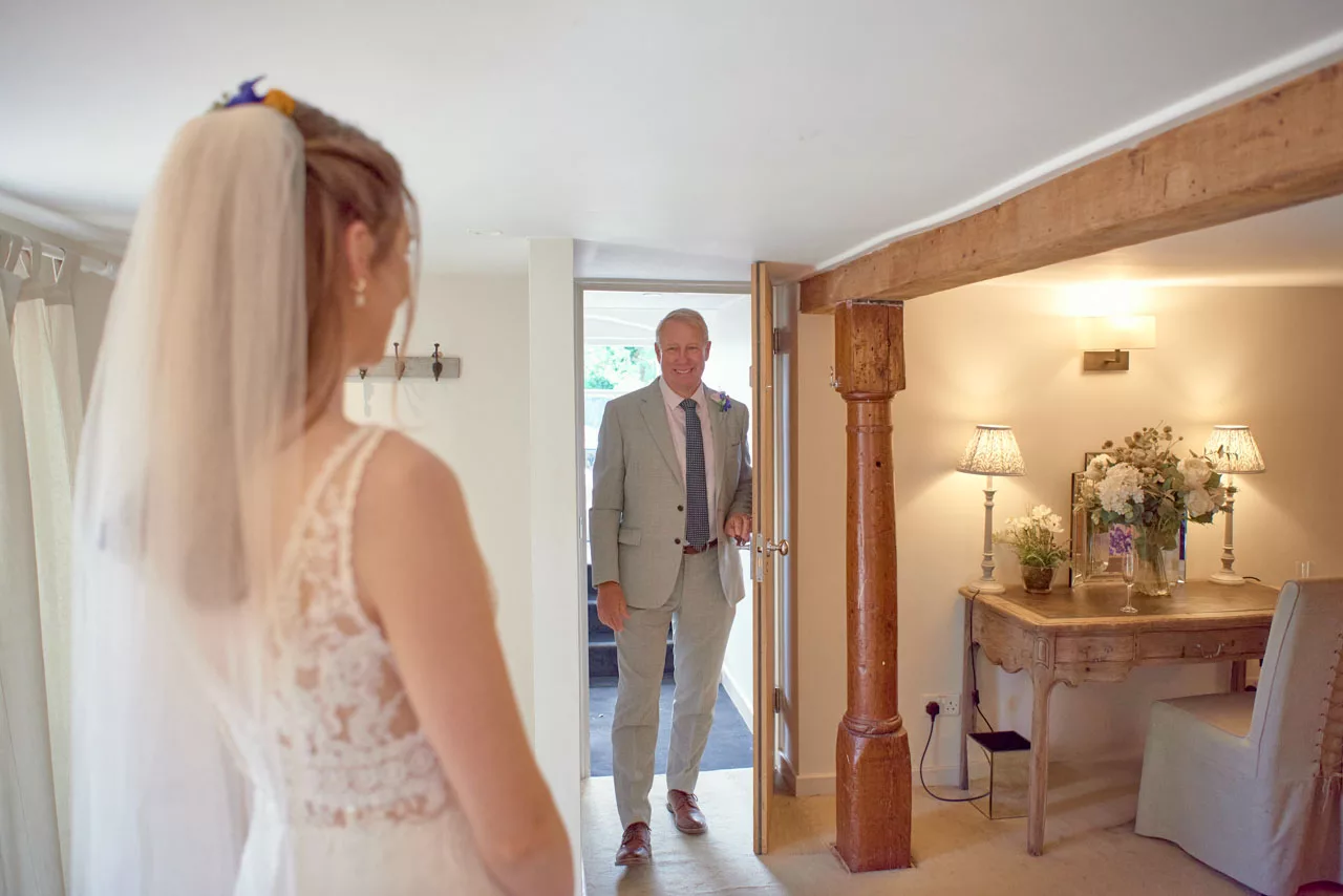 Smiling Fathers first look at Bride before the ceremony at Sopley Mill