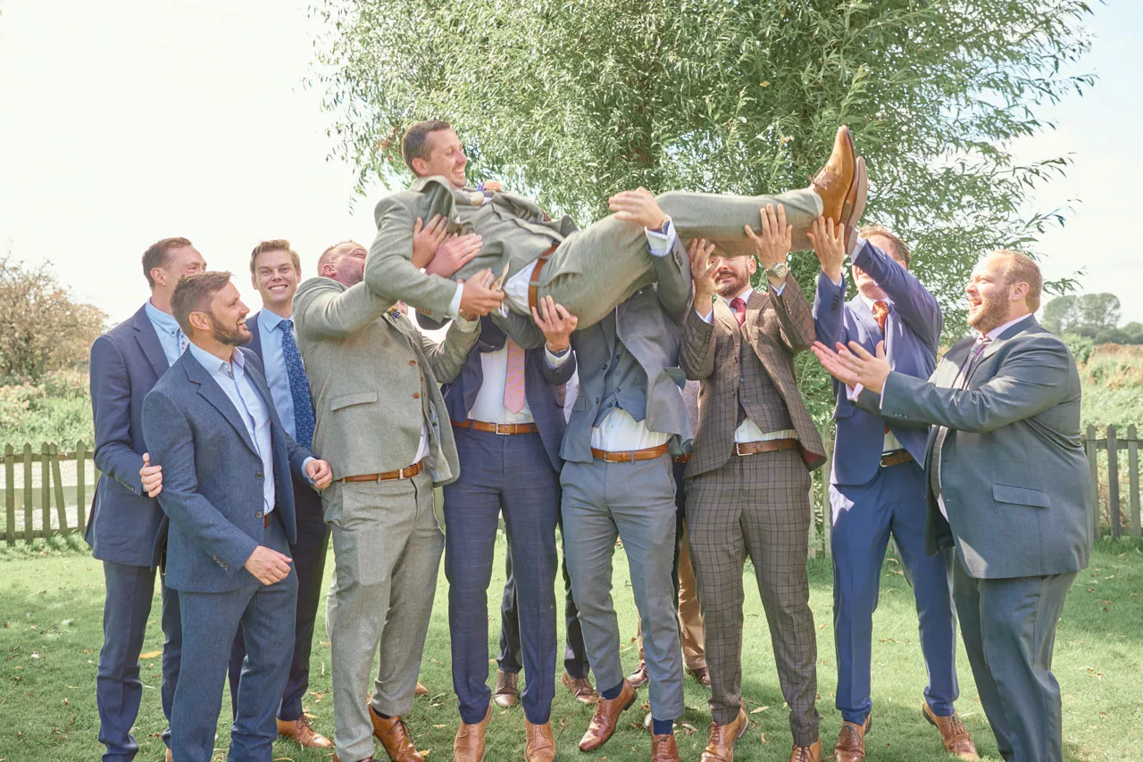 Groom having fun during a wedding at Sopley Mill