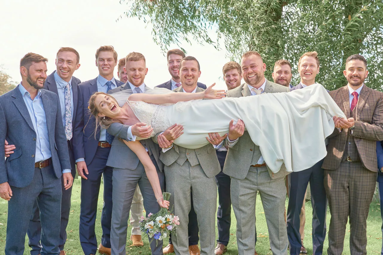 Bride having fun during a wedding at Sopley Mill