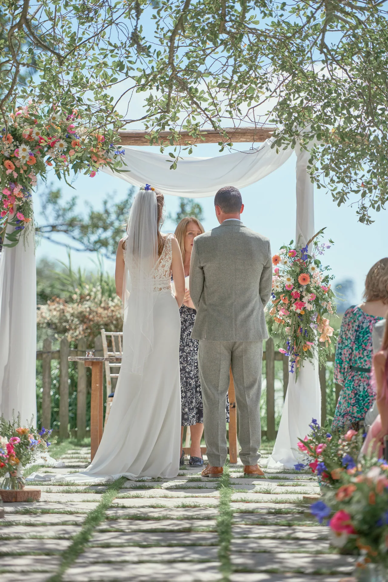 Bride and groom during an outdoor wedding ceremony at Sopley Mill