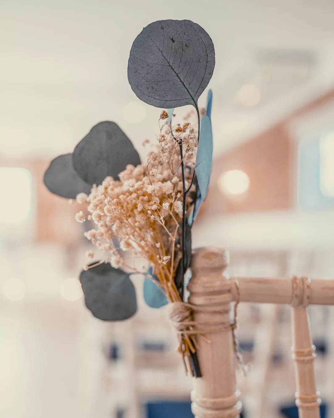 Ceremony room chairs at Sopley Mill styled with pampas grass