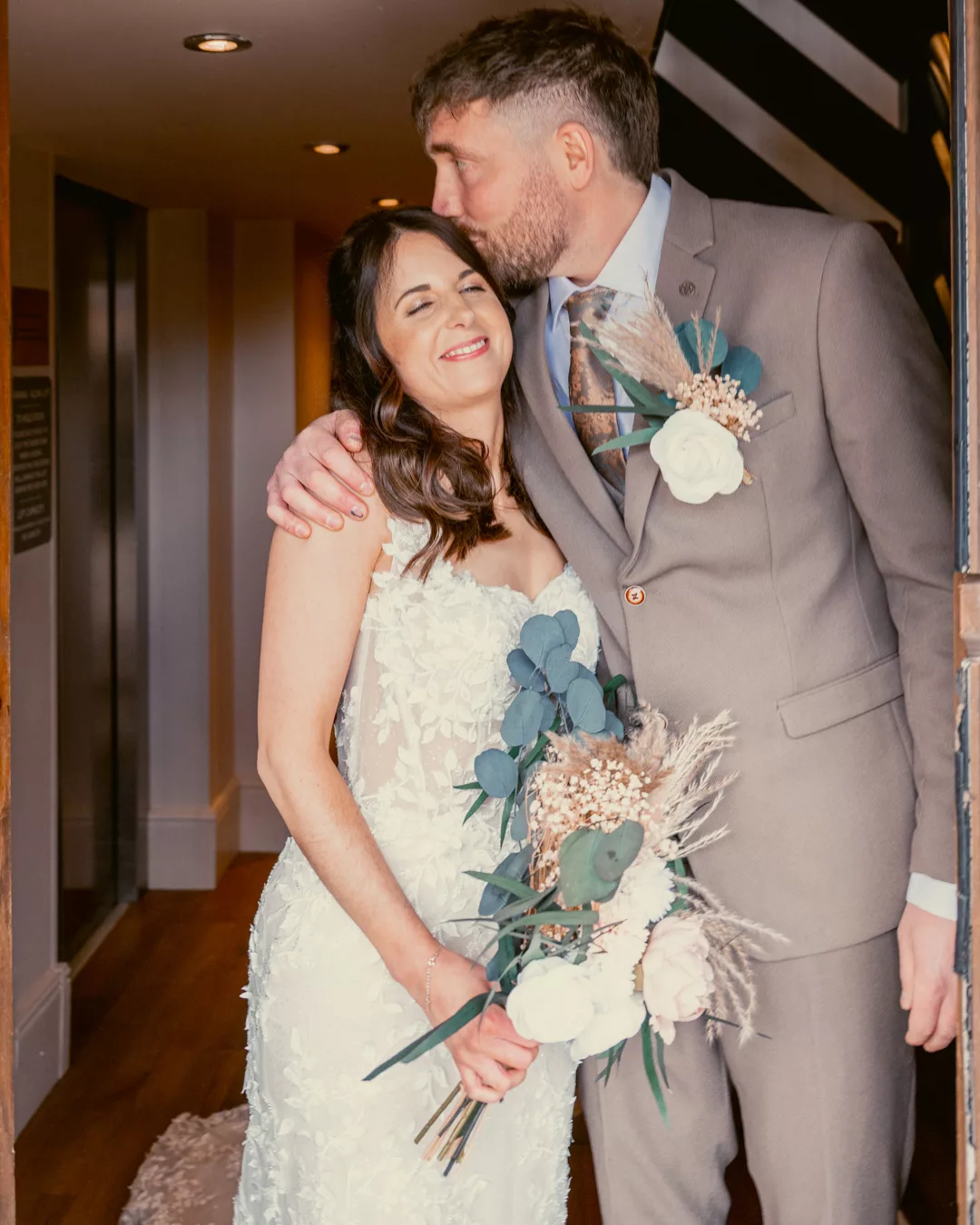 Bride & Groom in the doorway at Sopley Mill after their wedding