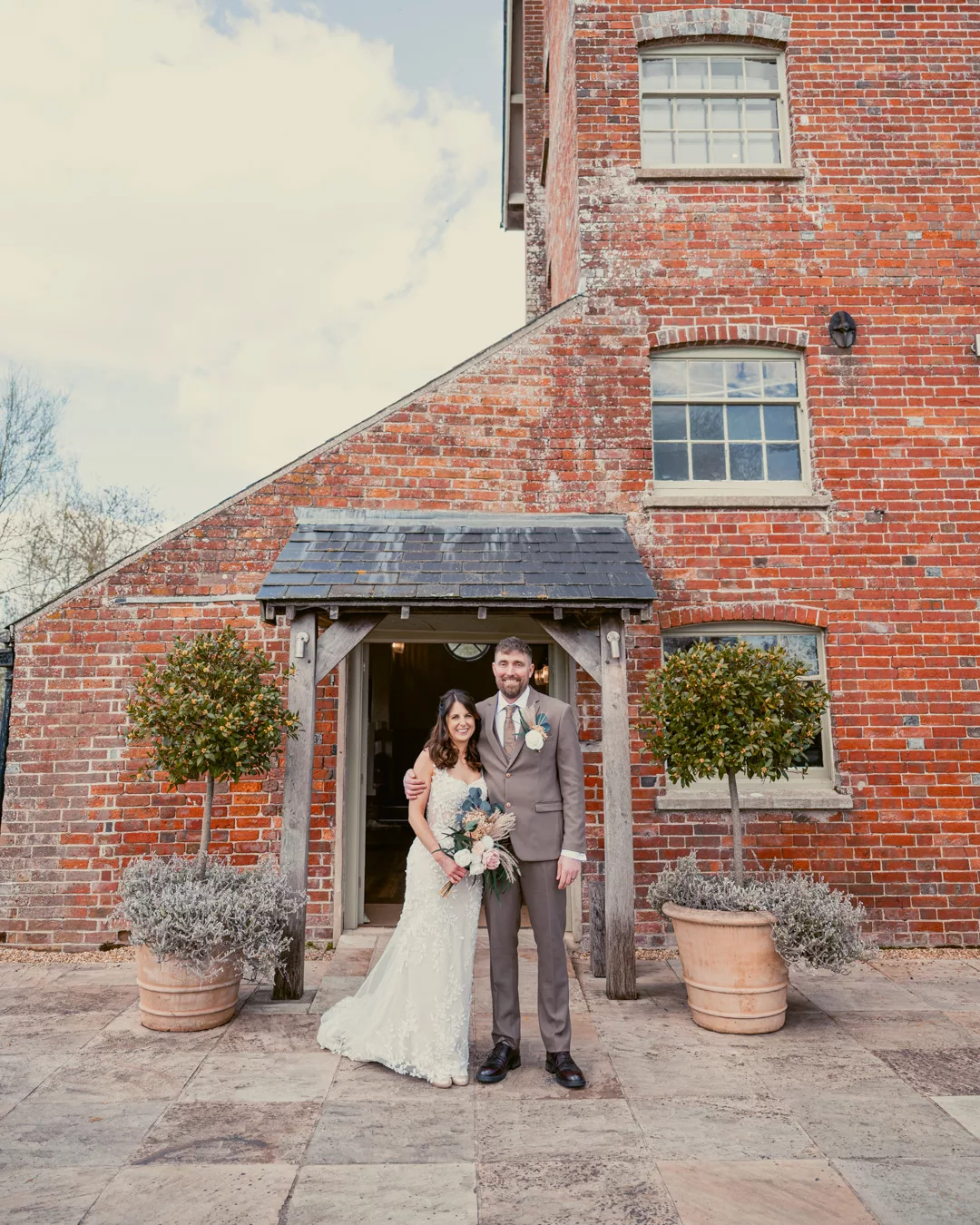 Bride & Groom outside the boat room at Sopley Mill after their wedding