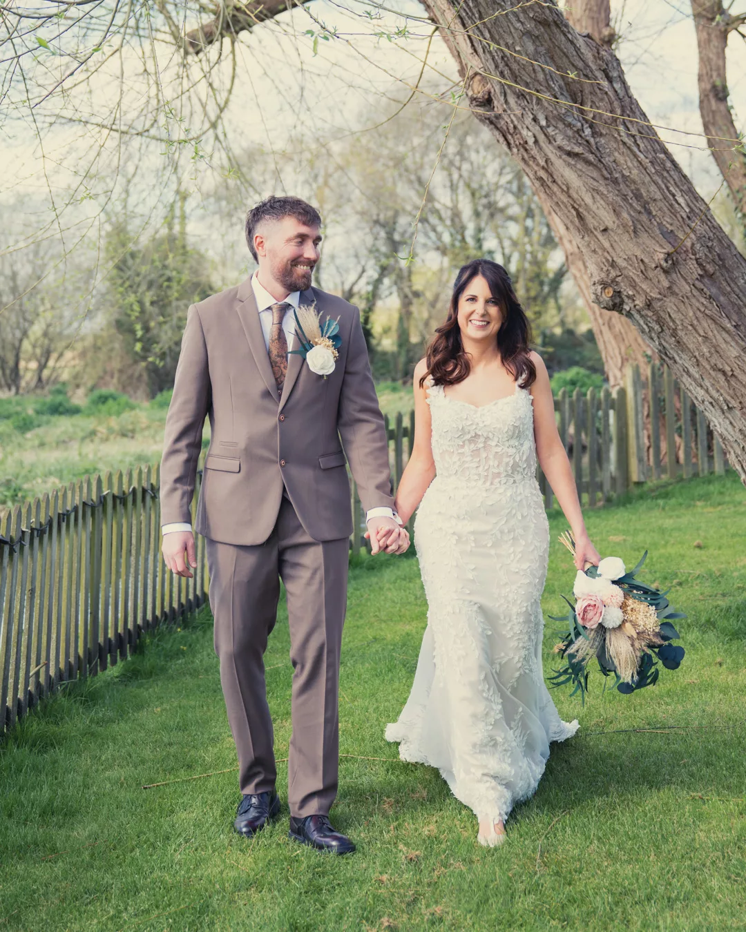 Bride and groom in the grounds of Sopley mill during a Spring wedding