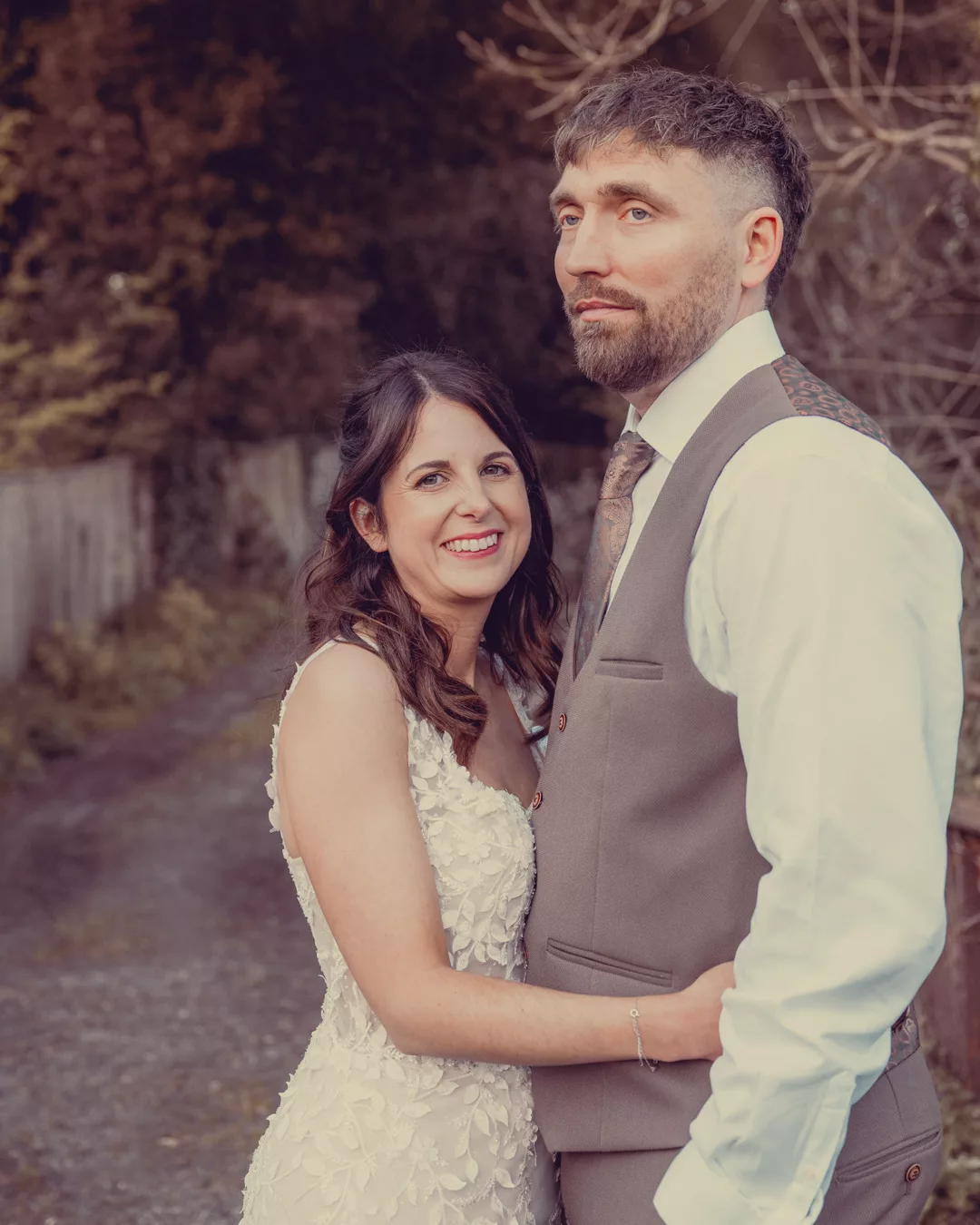 Bride and groom on the bridge of Sopley mill during a Spring wedding